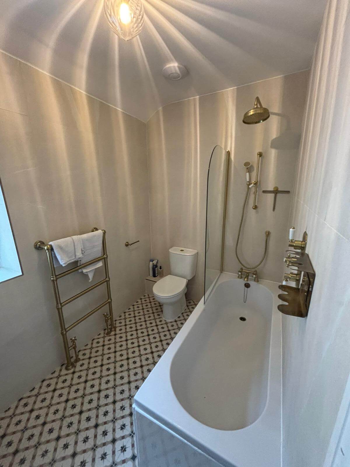Period-style bathroom in Penarth with brass fittings and a freestanding bath, installed by JM Plumbing Services