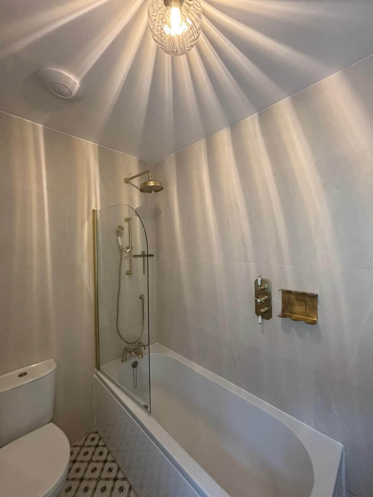 White and gold bathroom renovation in Cardiff completed by JM Plumbing Services